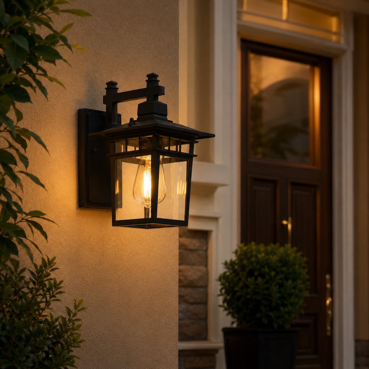 Avenor black outdoor porch wall lantern beside a premium front door with warm evening light