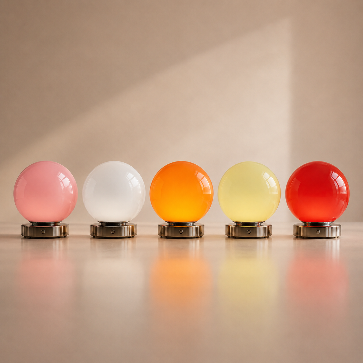 Lunora glass balloon table lamps shown in pink white orange yellow and red