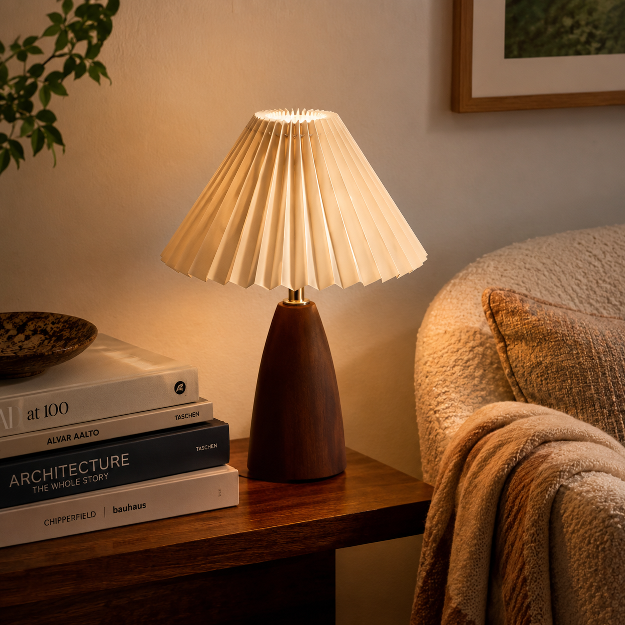 Marlow Pleated Wooden Table Lamp glowing warmly on a bedside table in a calm modern bedroom