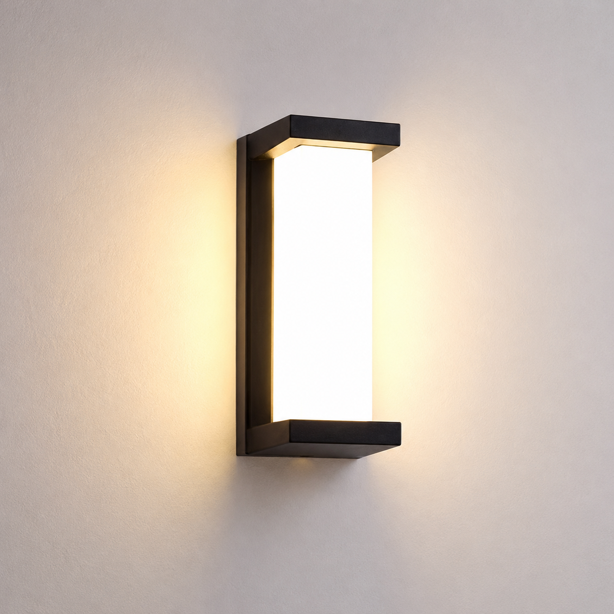 Ovara outdoor wall light creating soft lighting on a patio wall