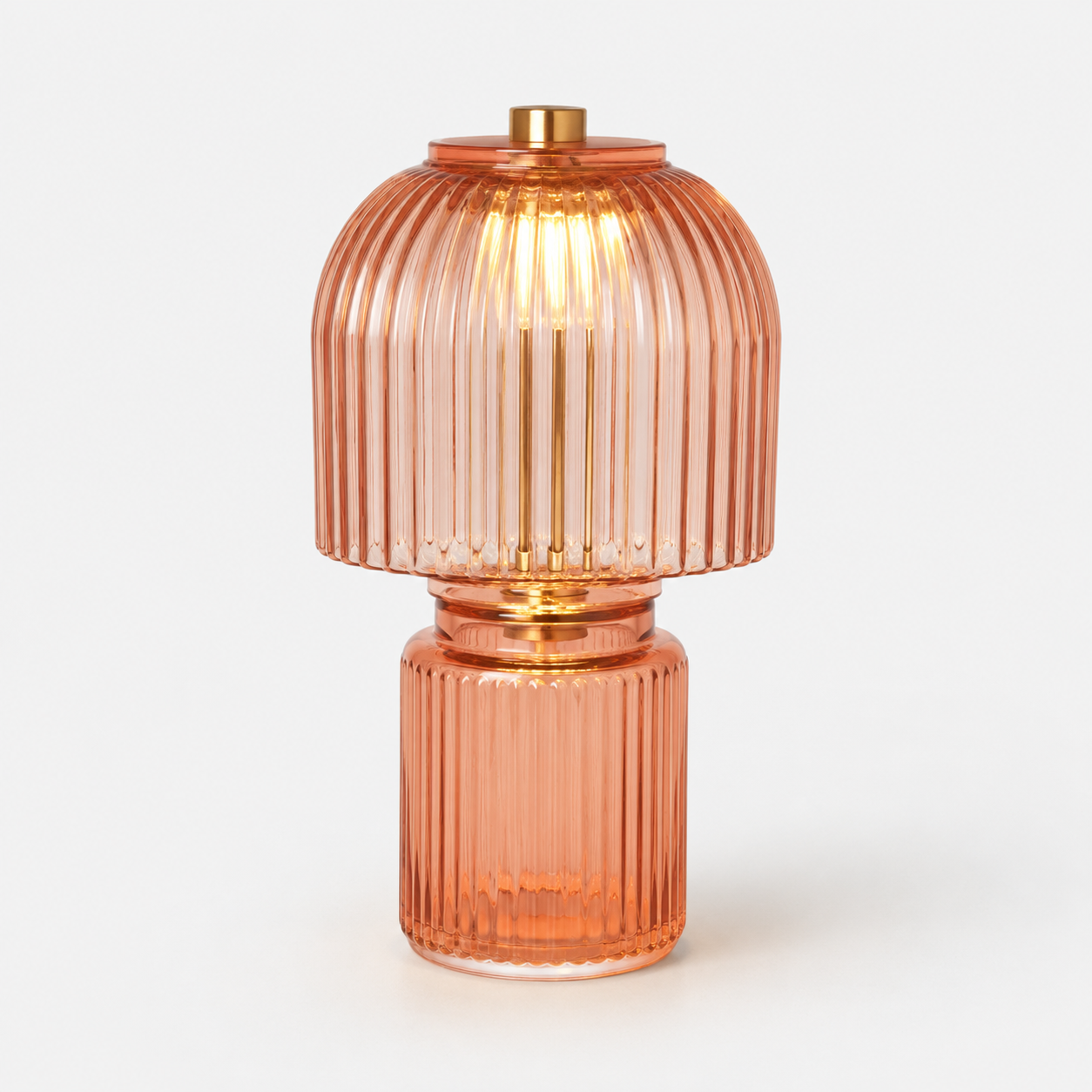 Amber stained glass table lamp with a warm glowing shade and elegant sculpted base.